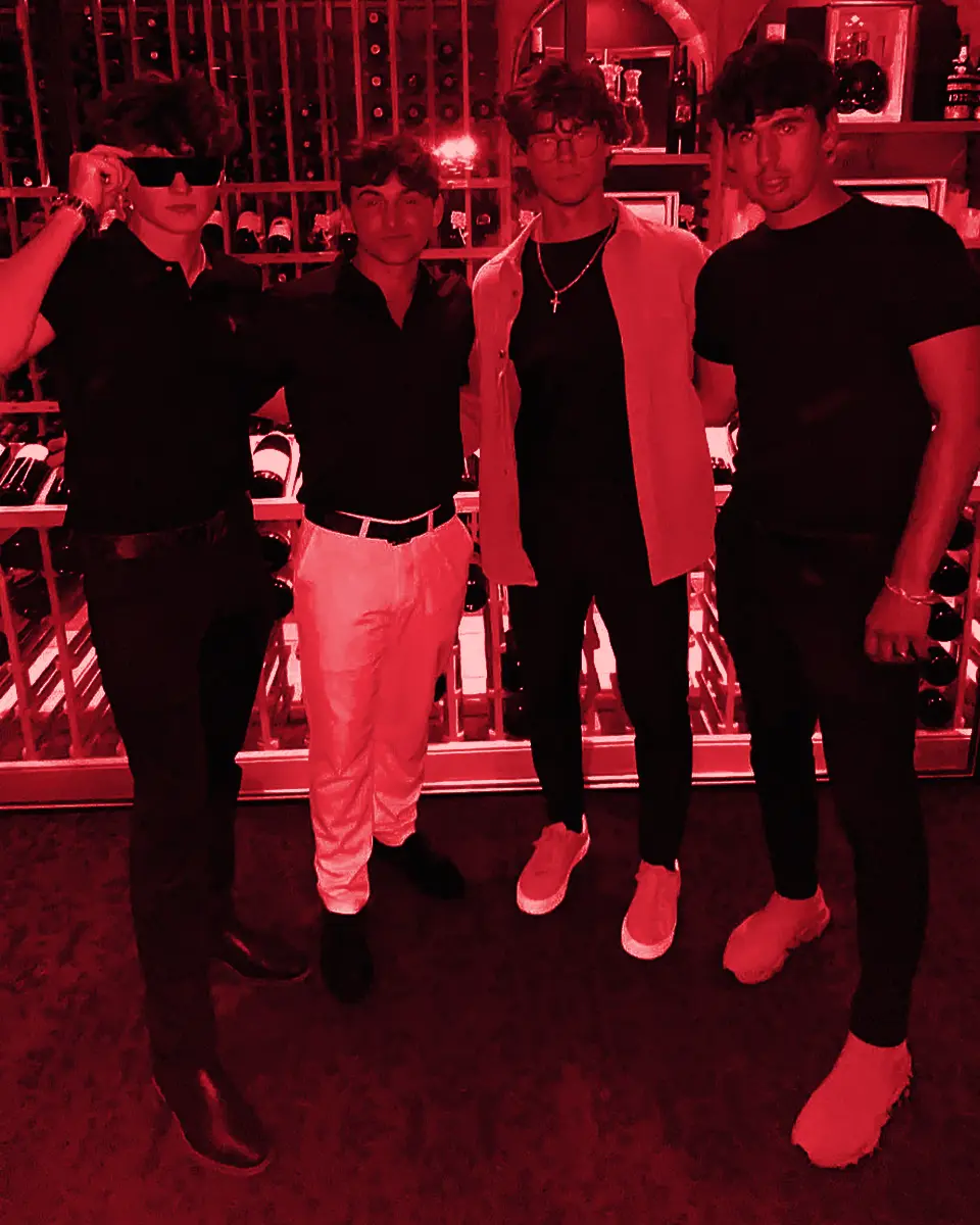 Four team members in black at dinner