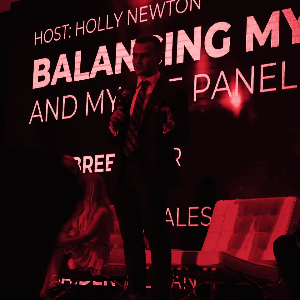 Caiden Sloan speaking on a panel at the Pinnacle summit in Miami